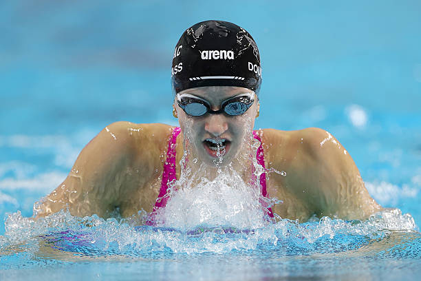 Kate Douglass competes in the Women's 100m Breaststroke heat during day 3 of the Toyota U.S. Open at Lee and Joe Jamail Texas Swimming Center on...