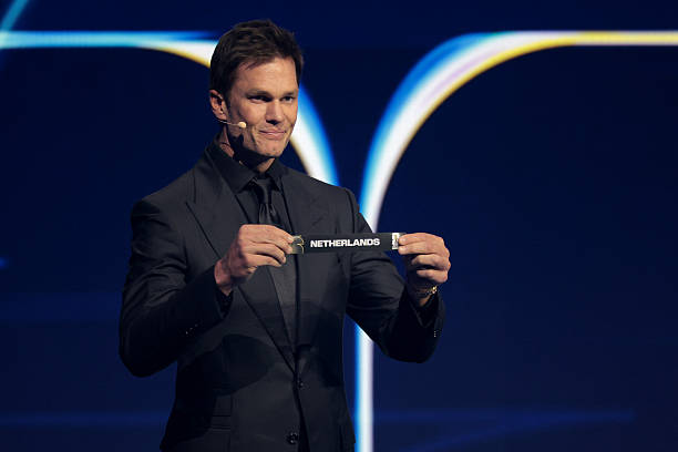 Draw assistant Tom Brady draws out the card of Netherlands during the FIFA World Cup 2026 Official Draw at John F. Kennedy Center for the Performing...