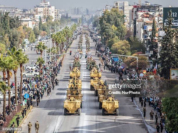 In Damascus, Syria, on December 8 a top view of a military parade by Syrian army units marks the first anniversary of liberation and the change of...