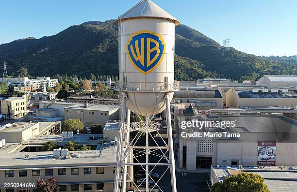 An aerial view of the Warner Bros. Logo displayed on the water tower at Warner Bros. Studio on December 5, 2025 in Burbank, California. Netflix and...