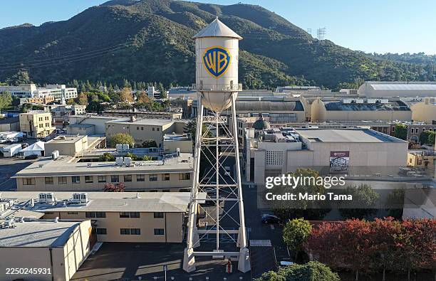 An aerial view of the Warner Bros. Logo displayed on the water tower at Warner Bros. Studio on December 5, 2025 in Burbank, California. Netflix and...
