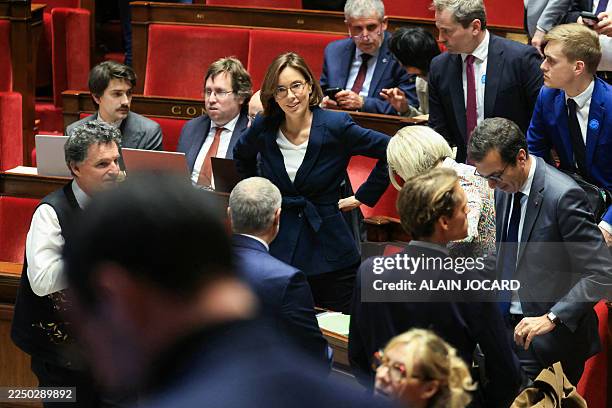 France's Public Accounts Minister Amelie de Montchalin and members of the government react after the result of the vote on the Social Security...