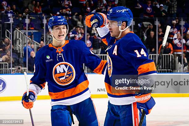 Bo Horvat of the New York Islanders celebrates his third-period goal at 10:15 with Matthew Schaefer against the Vegas Golden Knights at UBS Arena on...
