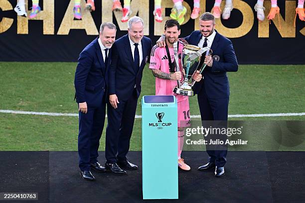 Lionel Messi of Inter Miami CF poses with Miami owners Jose Mas, Jorge Mas and Sir David Beckham and the winner's trophy after the Audi 2025 MLS Cup...