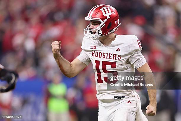Fernando Mendoza of the Indiana Hoosiers celebrates a touchdown against the Ohio State Buckeyes during the third quarter in the 2025 Big Ten Football...