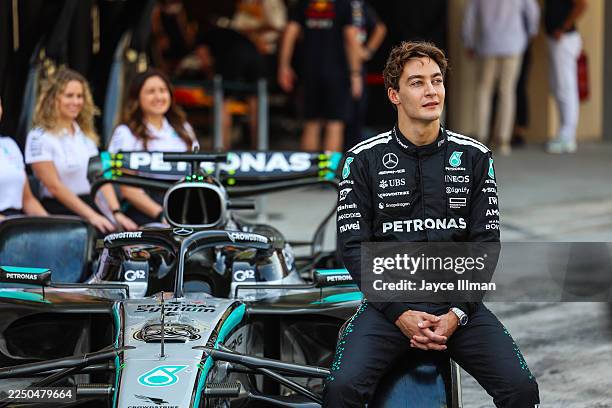 George Russell of Great Britain and Mercedeslooks on during the Mercedes team photo during the F1 Grand Prix of Abu Dhabi at Yas Marina Circuit on...