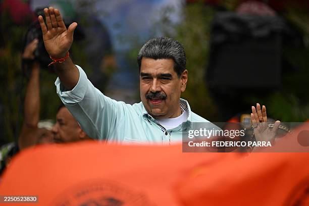 Venezuela's President Nicolas Maduro gestures during a rally to mark the anniversary of the Battle of Santa Ines, in Caracas on December 10, 2025.