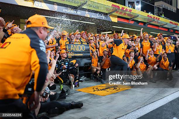 World Drivers Champion Lando Norris of Great Britain and McLaren Zak Brown, Chief Executive Officer of McLaren Andrea Stella, Team Principal of...