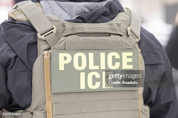 Immigrations, Customs, and Enforcement officers question a man's status on Lake Street near a Somali mall called the Karmel Mall in Minnesota, United...
