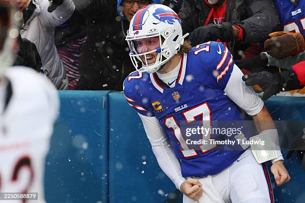 Josh Allen of the Buffalo Bills celebrates a 40-yard rushing touchdown against the Cincinnati Bengals during the fourth quarter at Highmark Stadium...
