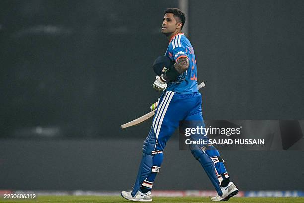 India's captain Suryakumar Yadav walks back to the pavilion after his dismissal during the second Twenty20 international cricket match between India...