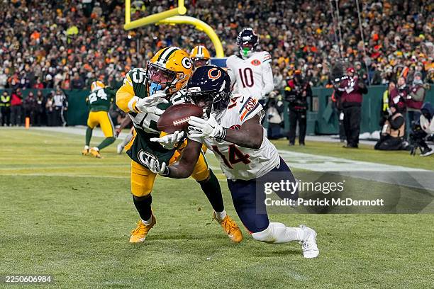 Olamide Zaccheaus of the Chicago Bears catches a touchdown pass against Keisean Nixon of the Green Bay Packers during the third quarter at Lambeau...