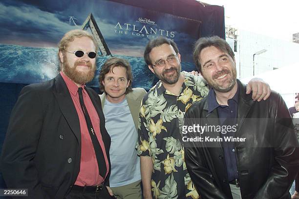Co-directors Gary Trousdale and Kirk Wise with Michael J. Fox and producer Don Hawn at the world premiere of 'Atlantis: The Lost Empire', Disney's...