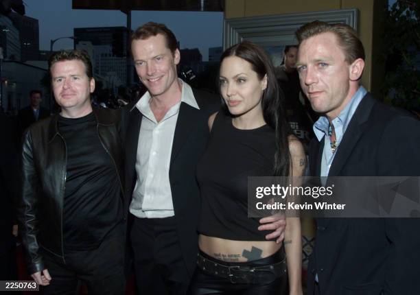 From left, director Simon West and cast members Iain Glen, Angelina Jolie and Daniel Craig before the premiere of the film 'Lara Croft: Tomb Raider'...