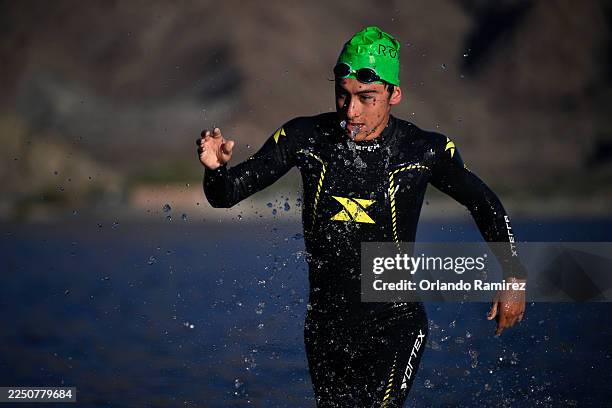 Athletes compete in the swim portion of the 2025 IRONMAN 70.3 La Quinta race on December 07, 2025 in La Quinta, California.