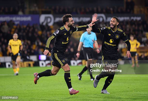 Bruno Fernandes of Manchester United celebrates scoring his team's first goal with teammate Matheus Cunha during the Premier League match between...