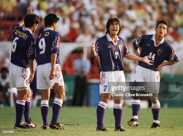 Toshihiro Hattori, Shoji Jo, team captain Masakiyo Maezono and Hidetoshi Nakata of Japan during the match against Brazil at the Orange Bowl Stadium...