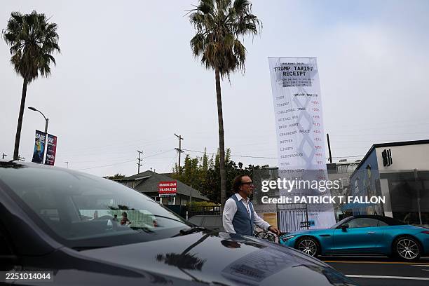 Foot-long banner, depicting a purchase receipt, is displayed by the progressive organization MoveOn to protest against US President Donald Trump's...