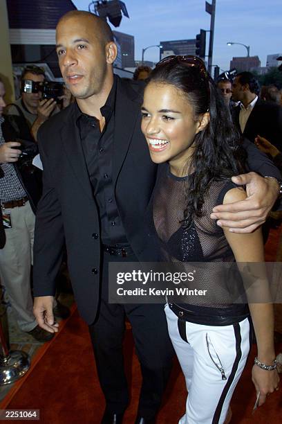 Cast members Michelle Rodriguez and Vin Diesel before the premiere of their film 'The Fast and the Furious' at Mann Village Theatre in Los Angeles,...