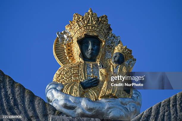 Close-up of a sculpted Black Madonna and child on top of a gate of the monastery of Jasna Gora, in Czestochowa, Silesian Voivodeship, Poland, on...
