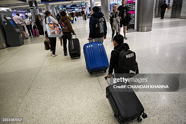 Deputy director of the Guatemalan-Maya Center Mariana Blanco escorts eleven-year-old Guatamalan citizen Alexis, thirteen-year-old Guatamalan citizen...