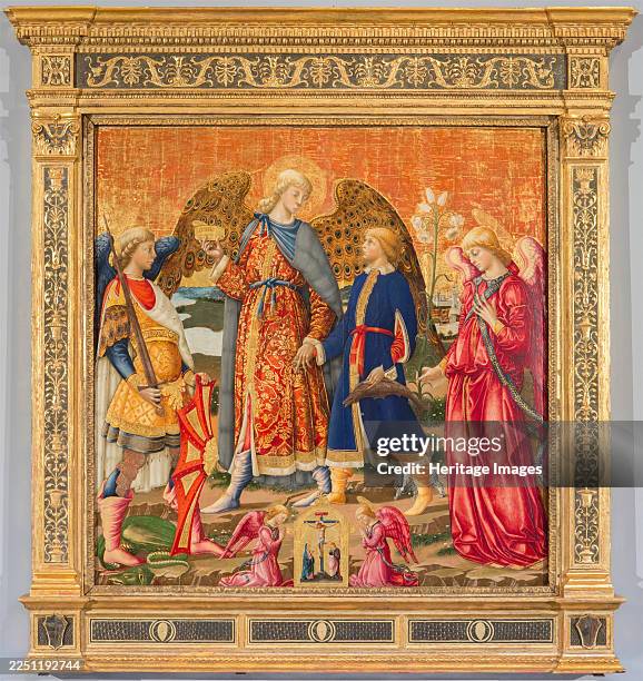 Tobias and Three Archangels, 1471. Tobias is led by the hand by the Archangel Raphael. On the left is Michael with his sword and shield - at his feet...