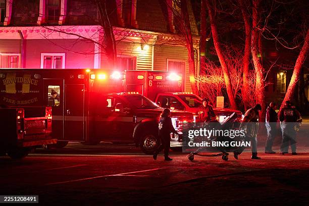First responders with the Providence Fire Department maneuver an empty stretcher near the Barus & Holley building, home to the engineering and...