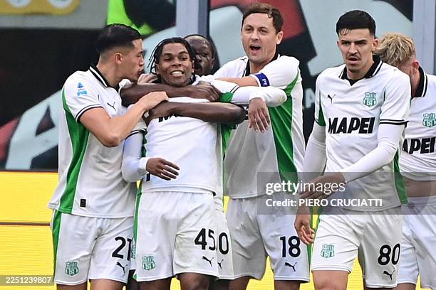 Sassuolo's French forward Armand Laurienté celebrates after scoring his team second goal during the Italian Serie A football match between AC Milan...