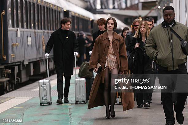 Actress Lily Collins arrives after boarding the luxury Orient Express train, to promote the release of the 10 new episodes of the TV series "Emily in...