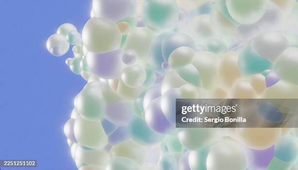 soft, spherical, pastel bubbles float against a clear blue sky background. illustration, rendering - translucent background stock illustrations