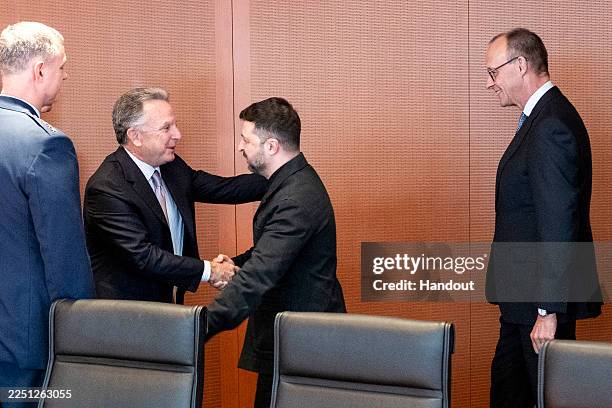 In this handout image provided by the German Government Press Office , German Chancellor Friedrich Merz looks on as US special envoy Steve Witkoff...