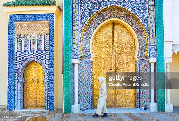 moroccan man walking - marrakesh stock pictures, royalty-free photos & images