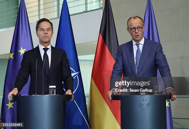 German Chancellor Friedrich Merz and NATO Secretary General Mark Rutte speak to the media following talks at the Chancellery on December 11, 2025 in...