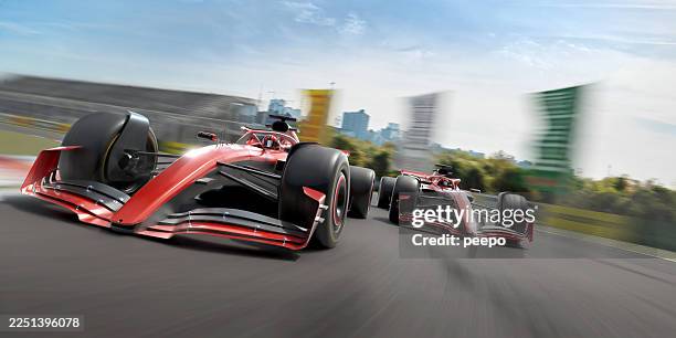 two racing cars taking corner at high speed - motorsport stock pictures, royalty-free photos & images