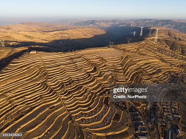 The terraced field scenery is captured in Daping Village, Dingxi City, Gansu Province, China, on December 14, 2025.