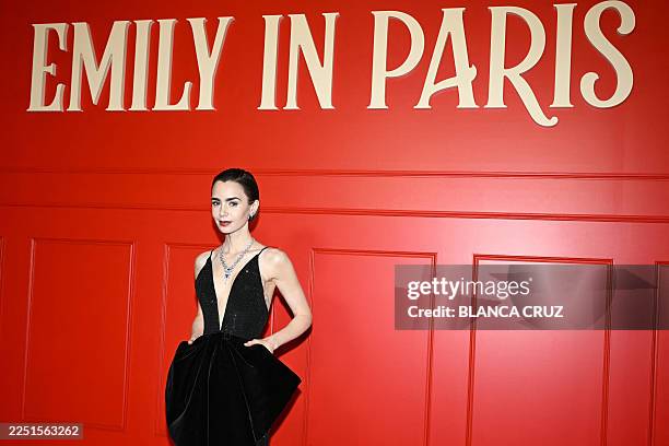 Actress Lily Collins poses during the avant-premiere of Netflix TV series "Emily in Paris" season 5, at the Grand Rex, in Paris on December 15, 2025.