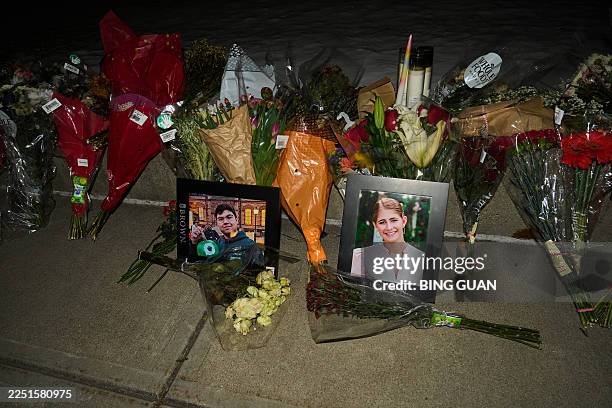 Framed photos of mass shooting victims Mukhammad Aziz Amurzokov and Ella Cook are seen at a makeshift memorial near Brown University in Providence,...