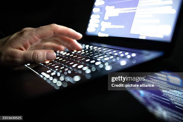 December 2025, Berlin: A person types with his fingers on an illuminated laptop keyboard . Photo: Philip Dulian/dpa