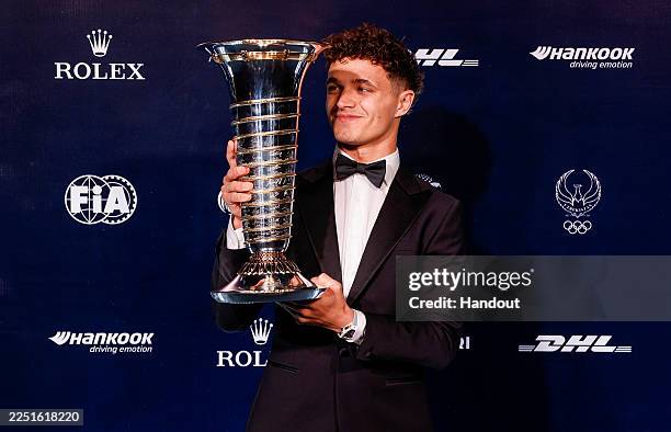 In this handout provided by Federation Internationale de l'Automobile , Lando Norris of Great Britain and McLaren with his Formula One Championship...