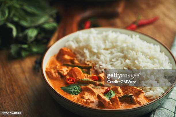 thai red curry served with basmati rice - asian food stock pictures, royalty-free photos & images