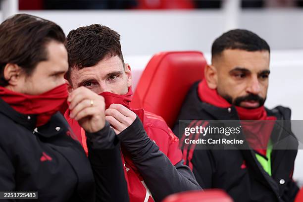 Andrew Robertson and Federico Chiesa of Liverpool speak to each other whilst Mohamed Salah of Liverpool looks on during the Premier League match...