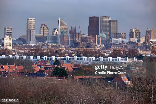 Skyline of administrative and residential high-rises emerges from the dunes on December 17, 2025 in The Hague, Netherlands. South Holland has been...