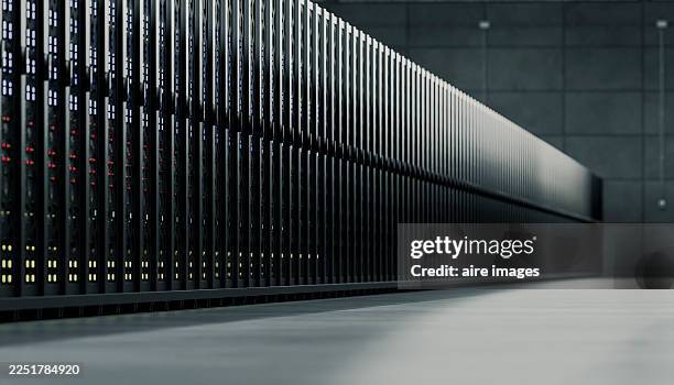 server racks filling data center room providing cloud hosting - centro de datos fotografías e imágenes de stock