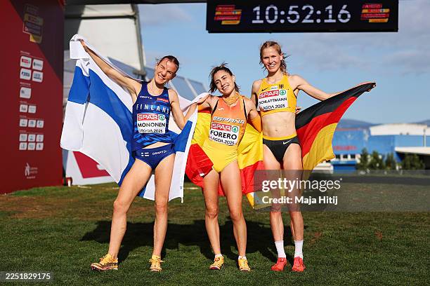 Second place Ilona Mononen of Finland, first place Maria Forero of Spain and third place Pia Schlattmann of Germany pose for a photo following the...