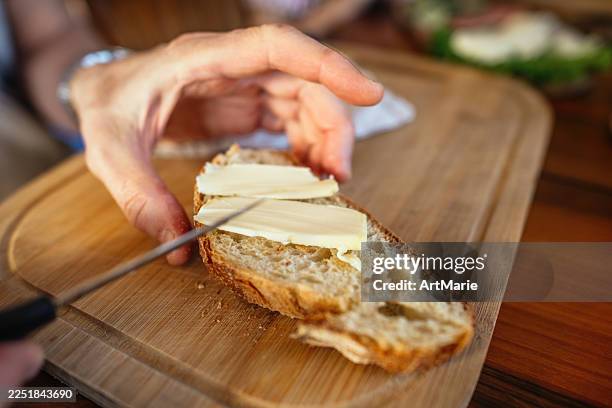 senior man making breakfast - buttering stock pictures, royalty-free photos & images