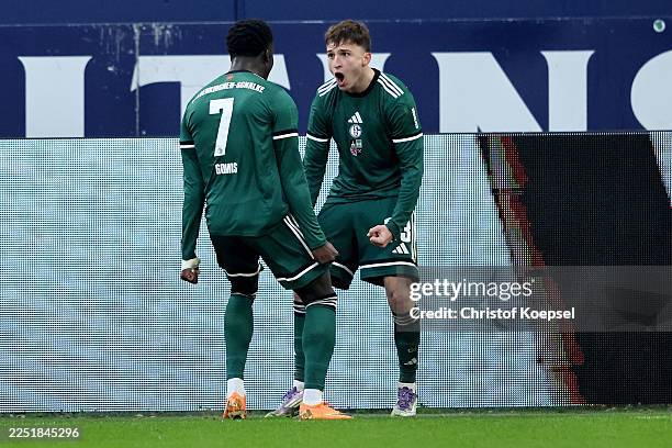 Vitalie Becker of FC Schalke 04 celebrates the first goal with Christian Gomis of FC Schalke 04 during the 2. Bundesliga match between FC Schalke 04...