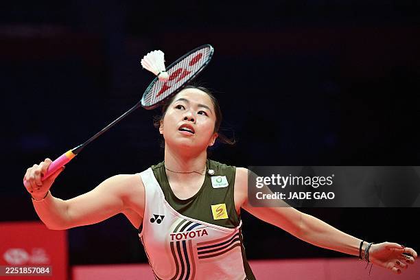 Thailand's Ratchanok Intanon hits a return to China's Wang Zhiyi during their women's singles match at the BWF Badminton World Tour Finals at the...
