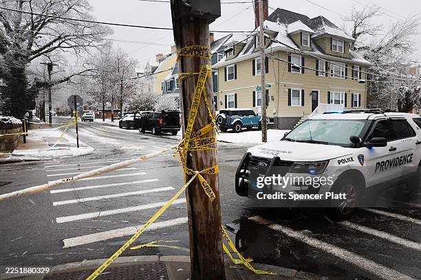 Police patrol Brown University following a mass shooting yesterday that left at least two people dead and nine others injured on December 14, 2025 in...