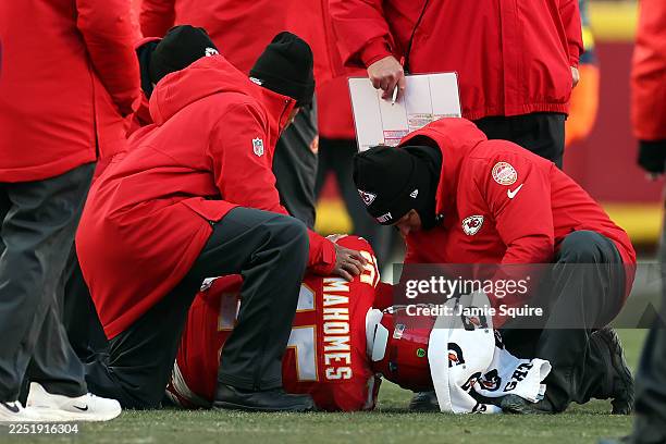 Patrick Mahomes of the Kansas City Chiefs lays on the ground after sustaining an injury during the fourth quarter against the Los Angeles Chargers at...