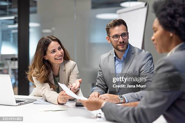 business people having a meeting in the office - female likeness stock pictures, royalty-free photos & images